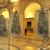 Luxurious interior with sparkling crystal bead curtains in mirrored frames and a chandelier.