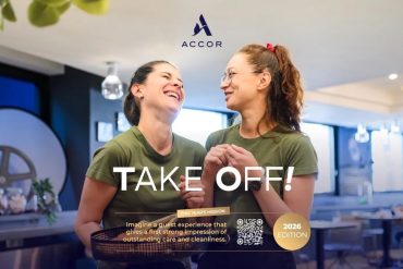 Two smiling women in green shirts share a moment in a modern cafe; ACCOR logo above and 'TAKE OFF!' headline overlaid.