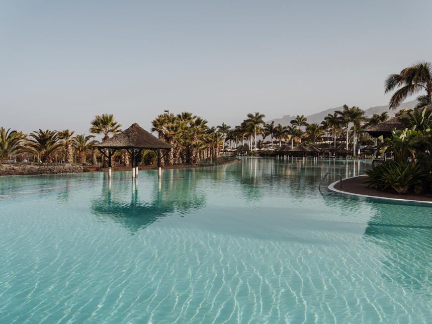 The resort's large infinity pool at sunset