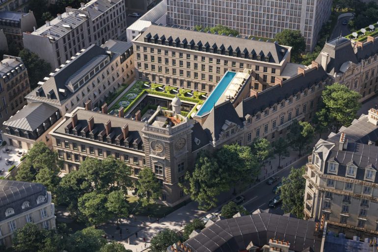 Aerial view of a historic city block with a central courtyard, blue rooftop pool, and manicured gardens.