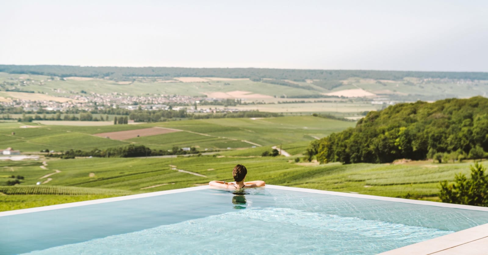 Royal Champagne's outdoor infinity pool overlooking the Champagne vineyard