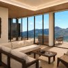 Le salon d'une suite d'Aso Retreat HONO ouvert sur les montagnes d'Aso, au Japon