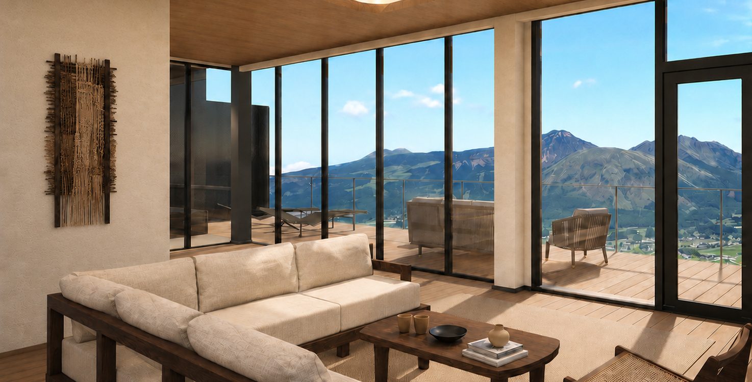 Le salon d'une suite d'Aso Retreat HONO ouvert sur les montagnes d'Aso, au Japon