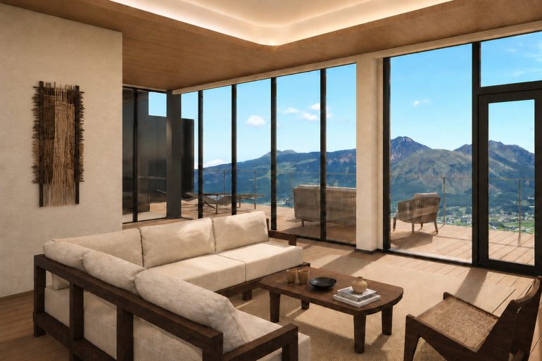 Le salon d'une suite d'Aso Retreat HONO ouvert sur les montagnes d'Aso, au Japon