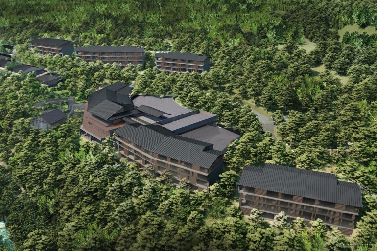 Modern hillside resort with dark-roofed lodges nestled among dense trees and winding paths on a forested slope