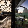 Le rooftop bar du QT Newcastle au coucher du soleil, actif de luxe du portefeuille racheté par Redcape