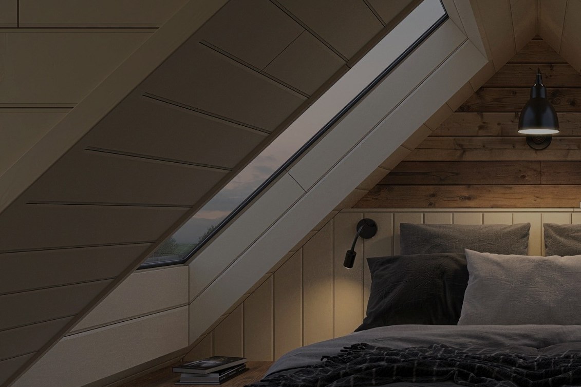 Un espace de repos de Reykjaböð, sous rampant, ouvert sur les collines