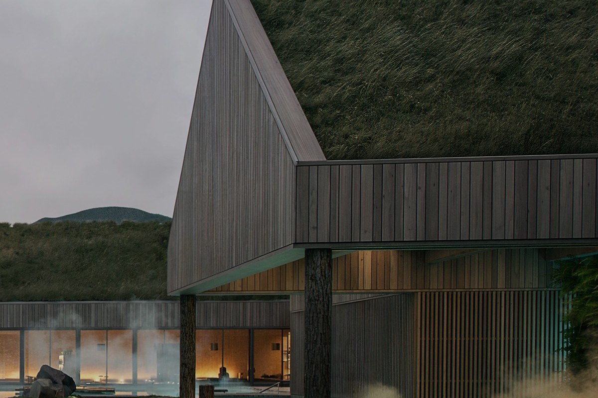 Le pavillon de Reykjaböð éclairé au crépuscule, au-dessus du bassin