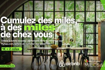 Banner promoting Airbnb Miles: large French headline over a glass-walled tropical dining room; man stands at a long table amid green accents on the sides.