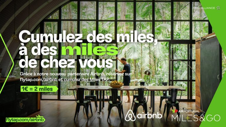 Banner promoting Airbnb Miles: large French headline over a glass-walled tropical dining room; man stands at a long table amid green accents on the sides.