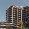 Rendu de la façade de l'Oakmond Marbella Wellness Clinic Resort, ancien hôtel Incosol, avec ses balcons ondulés dans la verdure