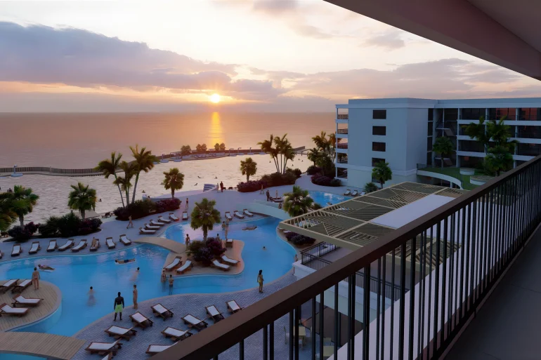Rendu des piscines du resort The Pyrmont Curaçao, nouvel hôtel tout compris pour adultes, face à la mer des Caraïbes au coucher du soleil, à Willemstad