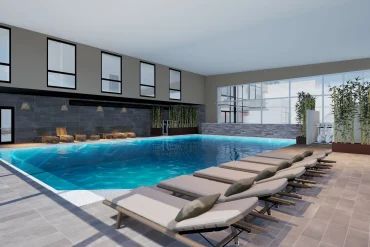 Rendu 3D de la piscine intérieure chauffée du spa Naïora à Strasbourg, bordée de transats et de bambous